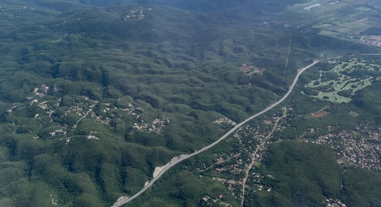 High altitude view of land formations and highway